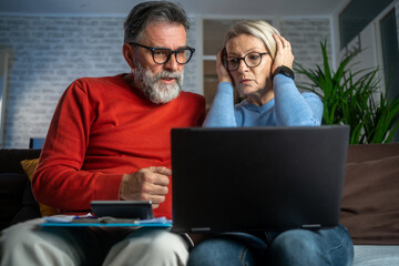Couple upset headache depressed from family cost got higher doing accounting holding receipts from...