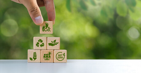 Reducing carbon emissions carbon neutral concept Net zero greenhouse gas emissions target The impact of human activities on the landscape and nature in general. Green block icon. Copy space
