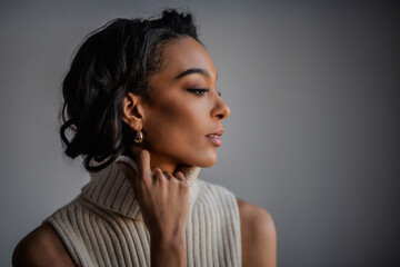 Attractive african american woman against grey background