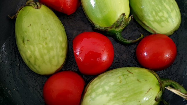 Making of an Indian Vegetable Food Dish Recipe of a Brinjal or eggplant also known as Baingan or Baigna Bharta in India Stage One