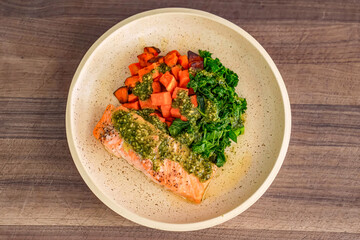 Healthy fresh meal with vegetables, salmon on plate. Homemade delicious lunch with salmon, greens for restaurant, menu, advert or package, close up selective focus. Top view.