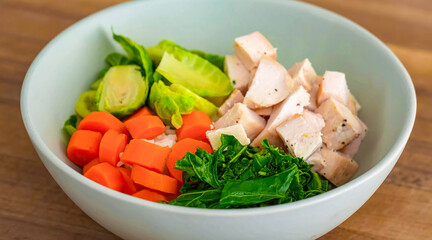 Healthy fresh salad with vegetables, chicken on plate. Homemade delicious lunch with chicken, kale, carrot for restaurant, menu, advert or package, close up selective focus