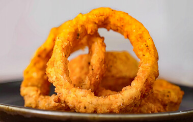 Onion rings fresh fried crunchy. Homemade onion rings for food or burger ingredient for restaurant, menu, advert or package, close up selective focus. - 723254000