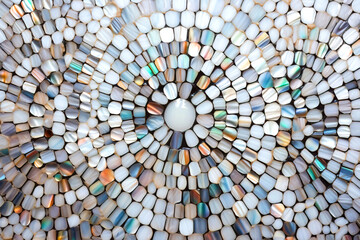 Abstract texture of white round mother of pearl shell tiles