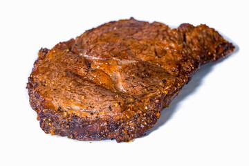 Beef steak grilled fillet meat with spices on white plate. Homemade roasted beef steak, serving food for restaurant, menu, advert or package, close up, selective focus - 723255226