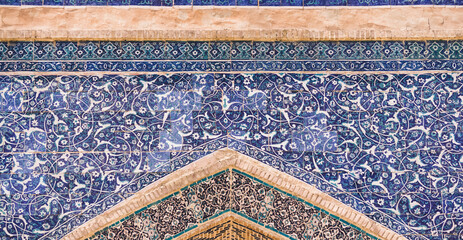 Element of the facade of a madrasah made of brick with mosaic cladding in the ancient city of...