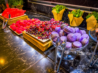 Candy bar. Table with sweets, candies, fruits, dessert buffet