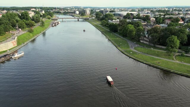 Vistula River, Wisla Seen From The Air In Cracow, Krakow, Poland, Polska. Flyover of Wisla Vistula River near the city centre of Crakow modern and historic architecture