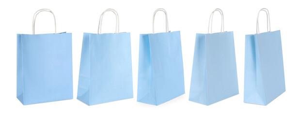 Light blue shopping bag isolated on white, different sides