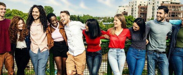 Multiracial Young Adults Sharing a Laugh in Urban Park