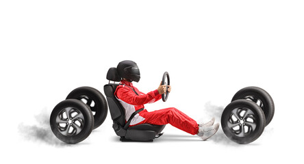 Racer in a car seat holding a steering wheel and driving fast