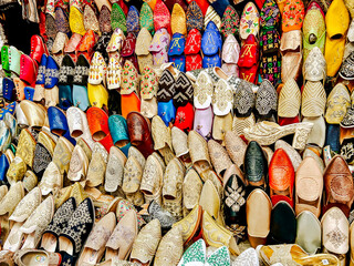 Tangier, Morocco - December 29, 2023: A selection of traditional shoes displayed at a souk vendor...