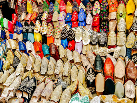 Tangier, Morocco - December 29, 2023: A selection of traditional shoes displayed at a souk vendor in Tangier, Morocco
