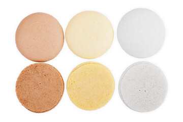 Flying sweet macaroons on white background