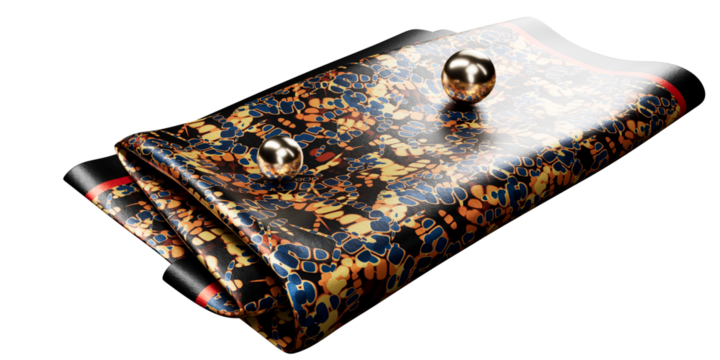 multi color abstract print silk pocket square with thick black and red border, isolated on a transparent background. Two golden metal balls on top of folded pocket square