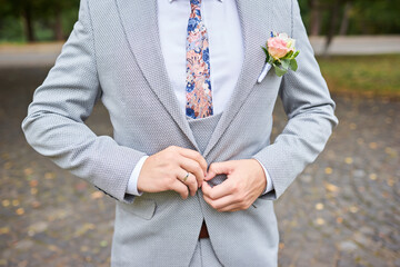 groom in a suit and a tie for a walk