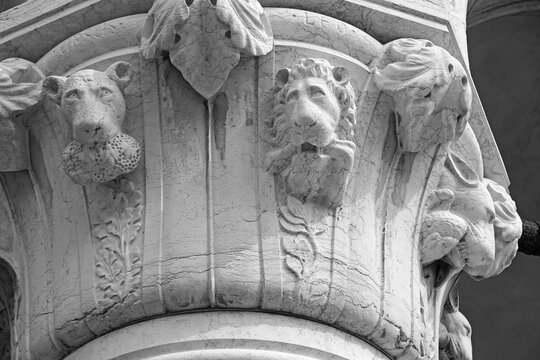 Venice, Italy, Sept. 17, 2023: Wild animal heads skillfully carved in relief decorate the capital of a medieval stone column at the Doge’s Palace.
