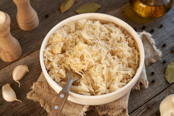 Fermented cabbage or sauerkraut in a white bowl