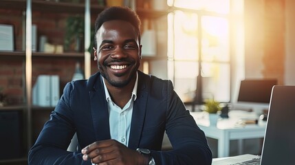 Obraz premium Portrait of businessman smiling while sitting at office. With a smile that lights up the room, this businessman brings positivity and energy to his workplace.