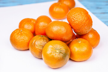 Tangerines on a white background - 723297026