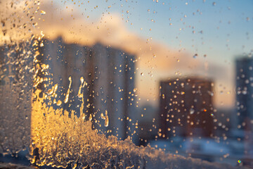 View of multi-storey residential buildings through a frosty window - 723297495