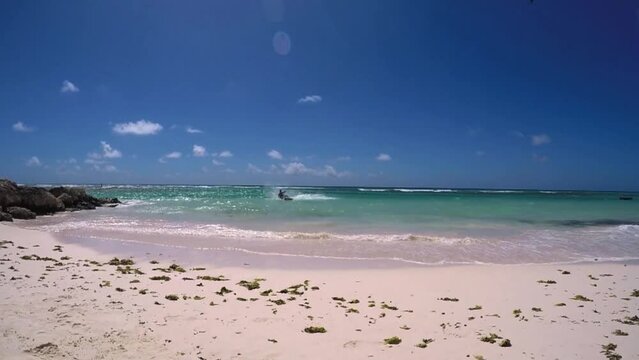 The Joyful Return of a Kite Surfer to Paradise's Shores.