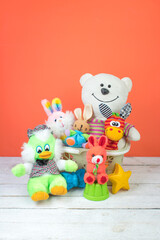 Collection of colorful toys on an orange background. Kids toys.