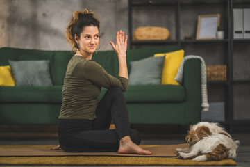 Woman practice yoga on mat in living room at home