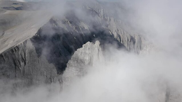 Cloudy Olympus mount aerial landscape cinematic footage. This footage is made with a dji mini 3 pro, this is a nature landscape cloudy footage of an Olympus peaks made in the day 