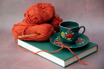 cup of coffee, knitting and book 