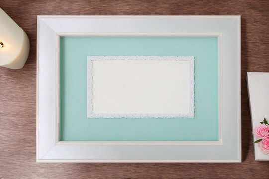 pink frame on a white table with a beige wall background