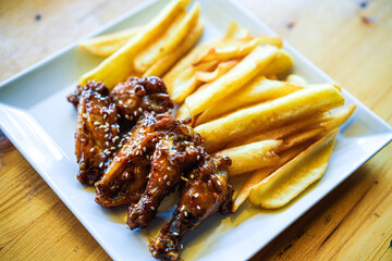 Chicken wings and legs with French fries