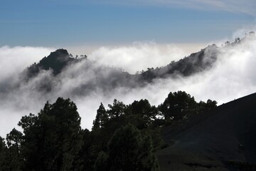 Beautiful mountain scenery of National Park Caldera de Taburiente with clouds lit by sun during...
