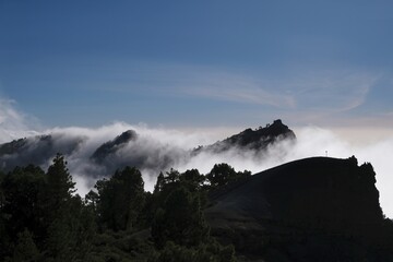 Beautiful mountain scenery of National Park Caldera de Taburiente with clouds lit by sun during...