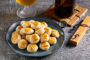 Savory buttery onion and glass of beer on the table.