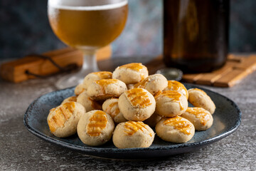 Savory buttery onion and glass of beer on the table.