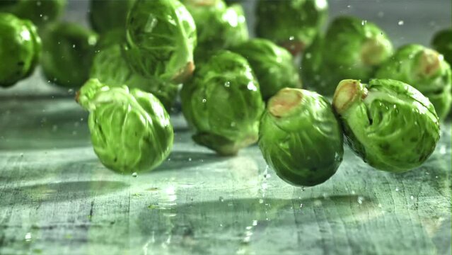Brussels sprouts fall on the table. Filmed on a high-speed camera at 1000 fps. High quality FullHD footage
