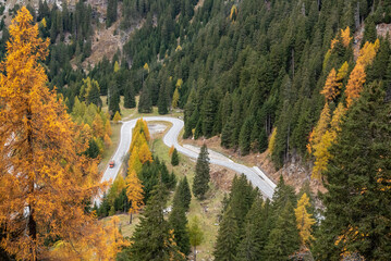 Scenic winding road at Maloja pass in autumn