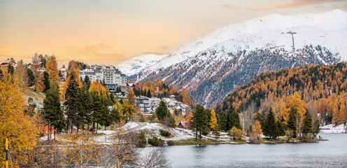 St. Moritz and lake in autumn, surrounded by snowcapped mountains