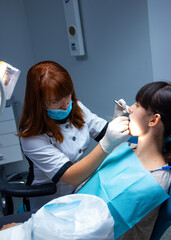 Hospital concept of mouth treatment. Teeth making dentist hands.