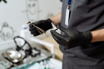 Hospital gloved hands holding device. Medical examination concept.