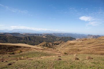 A picturesque view of the Biychesyn plateau and the Caucasus ridge from the Marinsky pass or Gumbashi pass (Gum-Bashi, Kum-Bashi) height 2187 meters. Karachay-Cherkessia. Russia