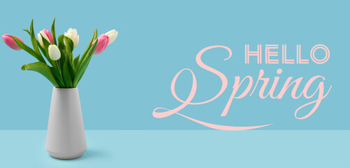 Vase with beautiful tulips and text HELLO, SPRING on light blue background