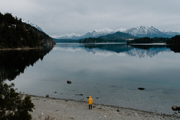 Man in a beautiful lake with mountains