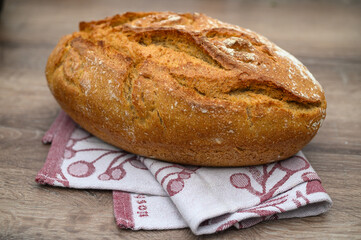freshly baked homemade bread in a towel in the kitchen 9