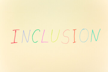 Word INCLUSION on beige background