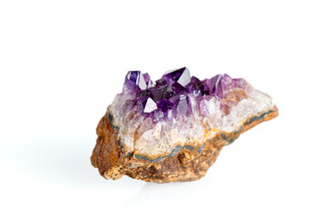 Amethyst mineral stone macro on white background