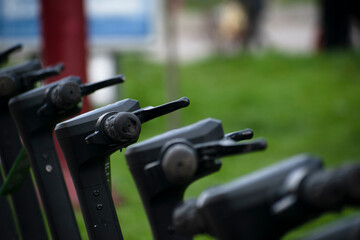 many electric scooters are parked on the streets of the citymany electric scooters are parked on the streets of the city