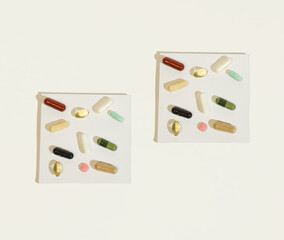 Pills and supplements on a white background. Minimal medical concept.Copy space. Flat lay.