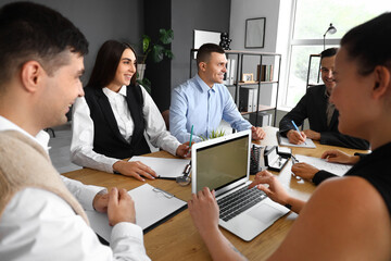 Business people negotiating at table in conference hall